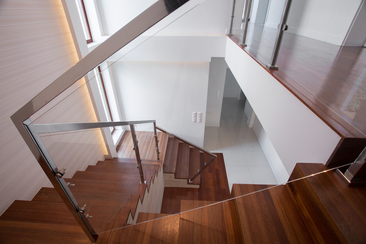 Modern stylish wooden and glass staircase in minimalistic design